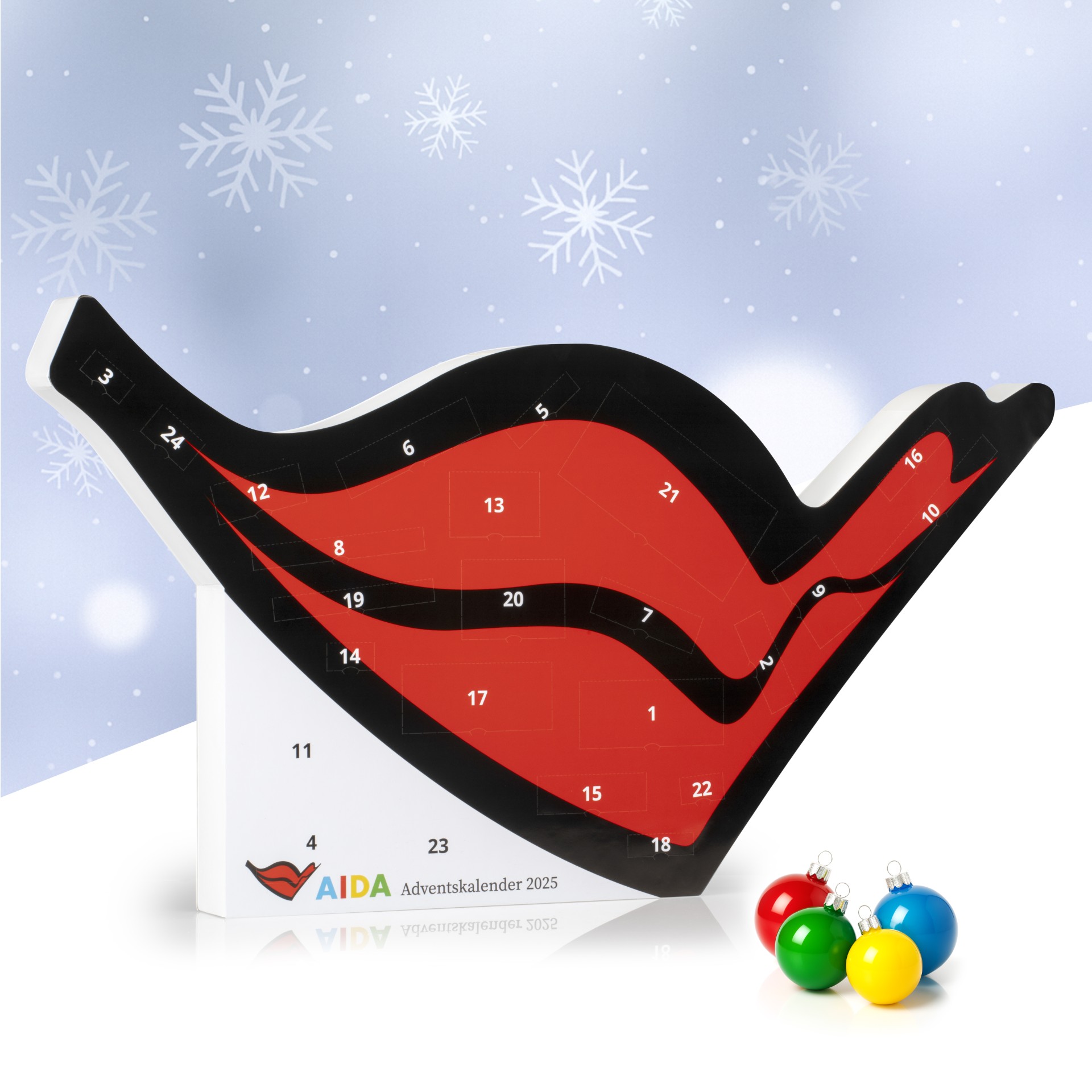 Großer, roter Adventskalender in Form eines stilisierten AIDA-Kussmunds mit schwarzen Konturen und weißen Zahlen auf 24 Türchen, verpackt in weißer Kartonage.